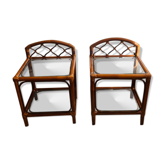 Two rattan and glass bedside tables