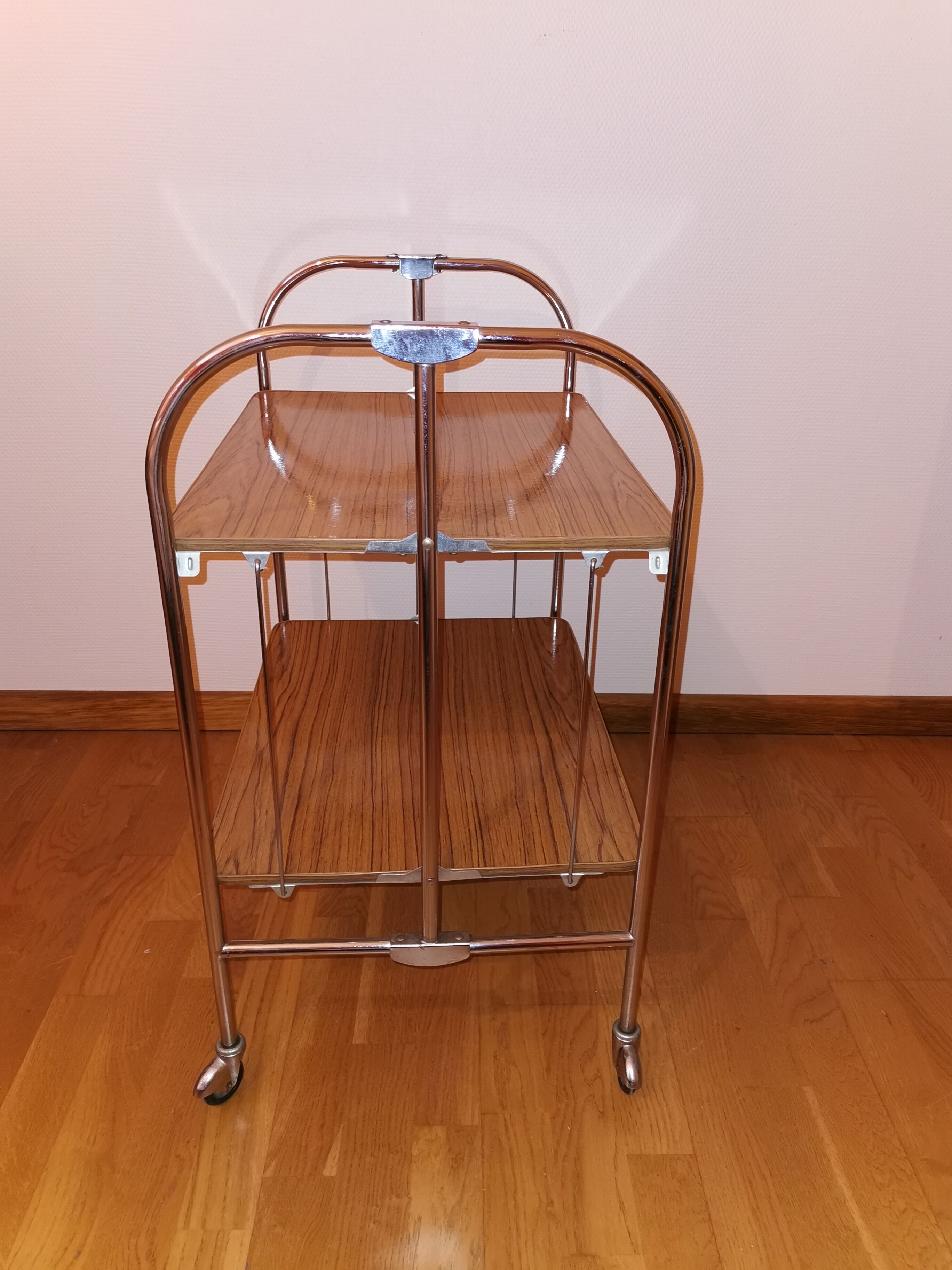 Vintage rolling and folding dessert trolley in chrome metal.