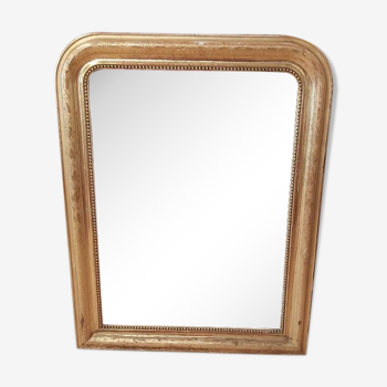 Golden Louis Philippe mirror with golden leafy