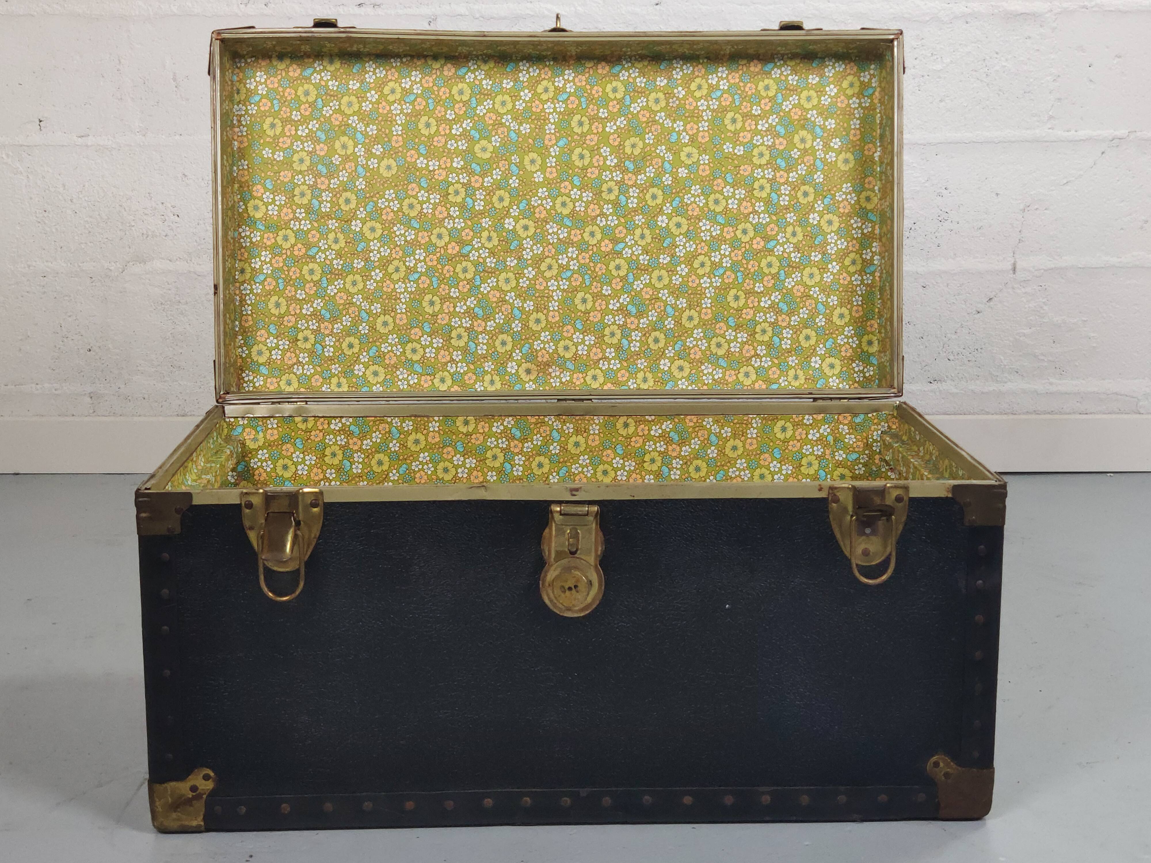 Old black trunk and brass
