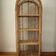 Rattan shelf on legs circa 1960
