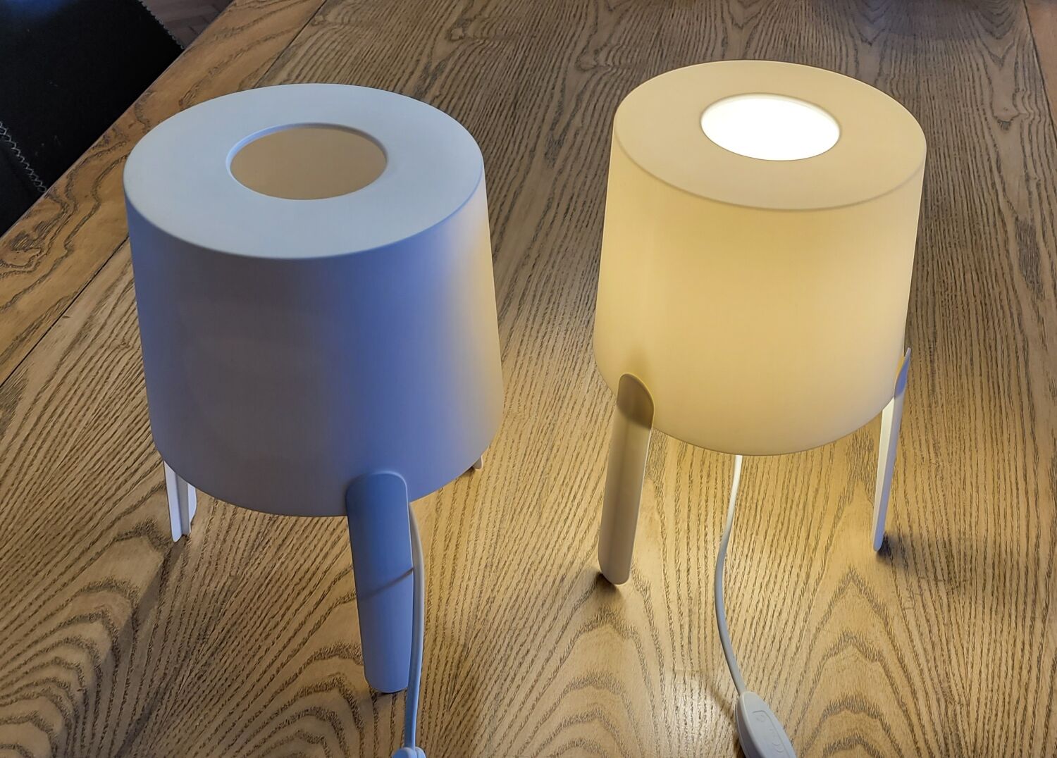 Pair of white Ikea Tvärs bedside lamps
