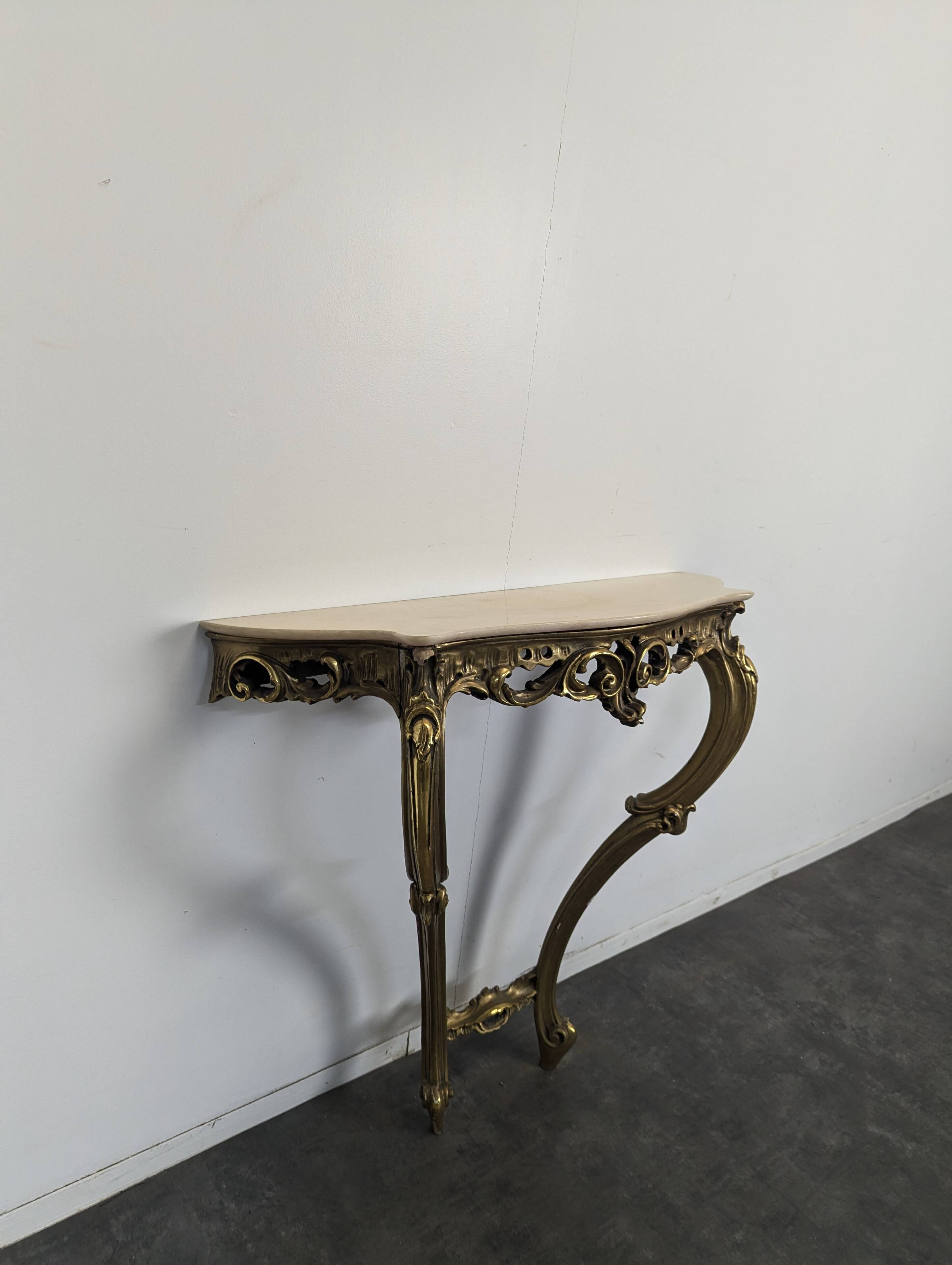 Golden wooden console in Louis XV style