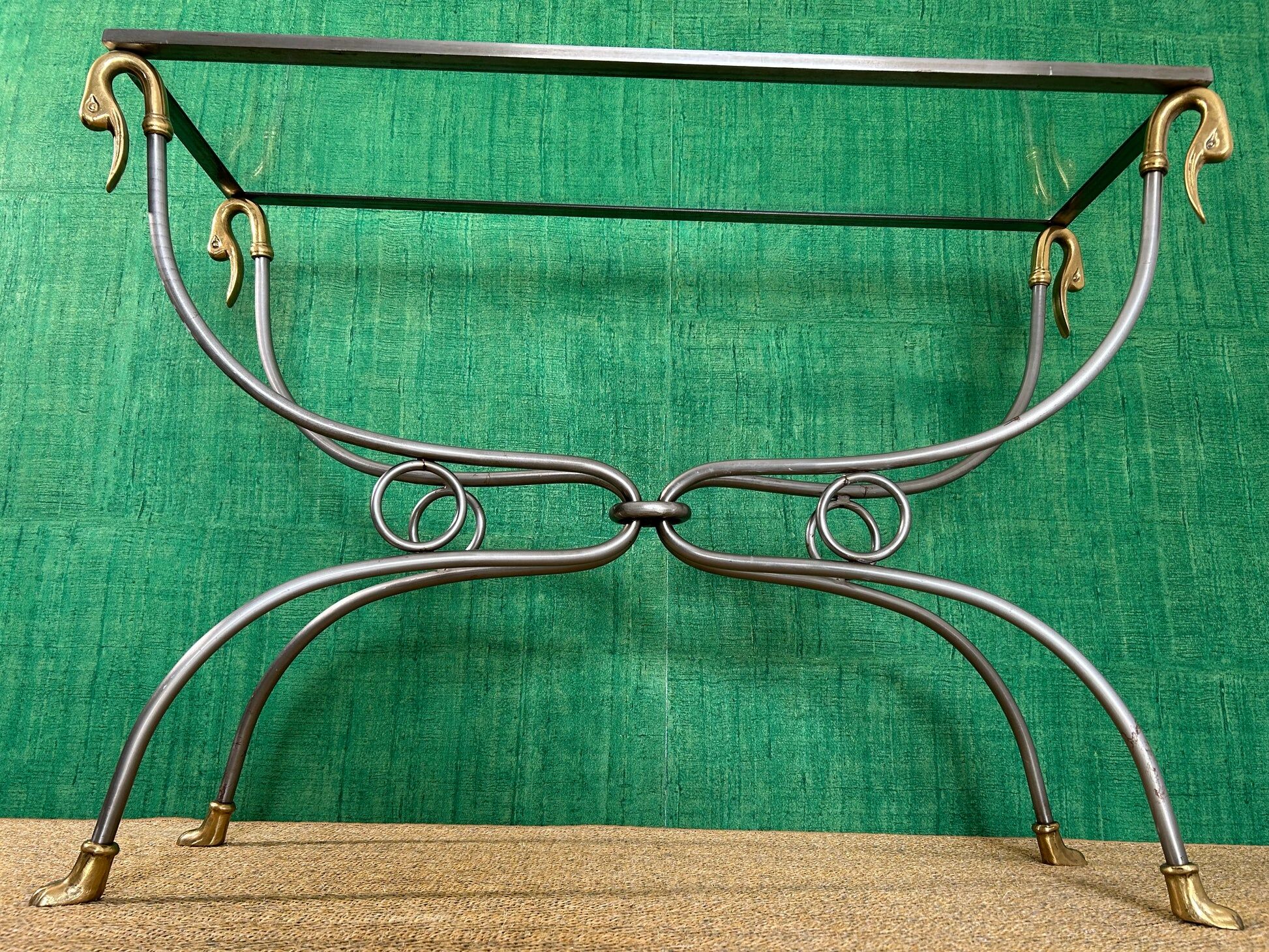 Polished steel and brass console, probably Maison Jansen, France, mid-century modern Hollywood Regency.