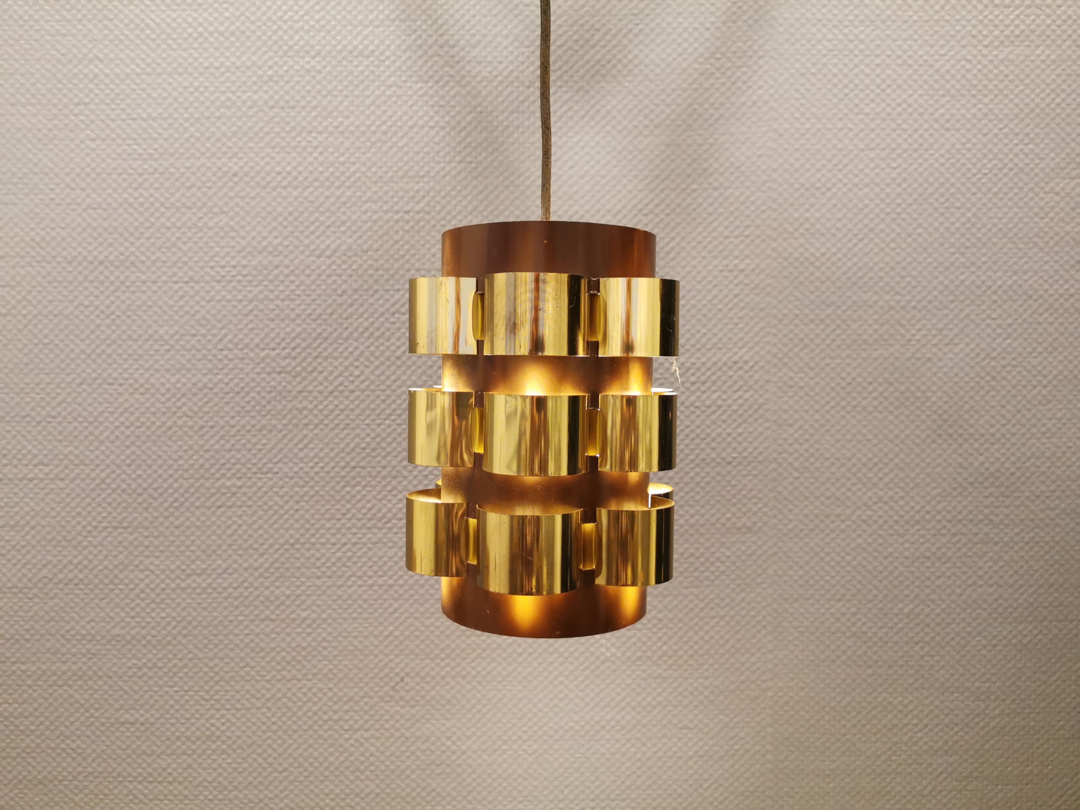 Danish hanging lamp from the 70s, in thin cut metal.