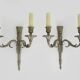 Pair of empire style double light wall lights in silvered bronze. the 50's
