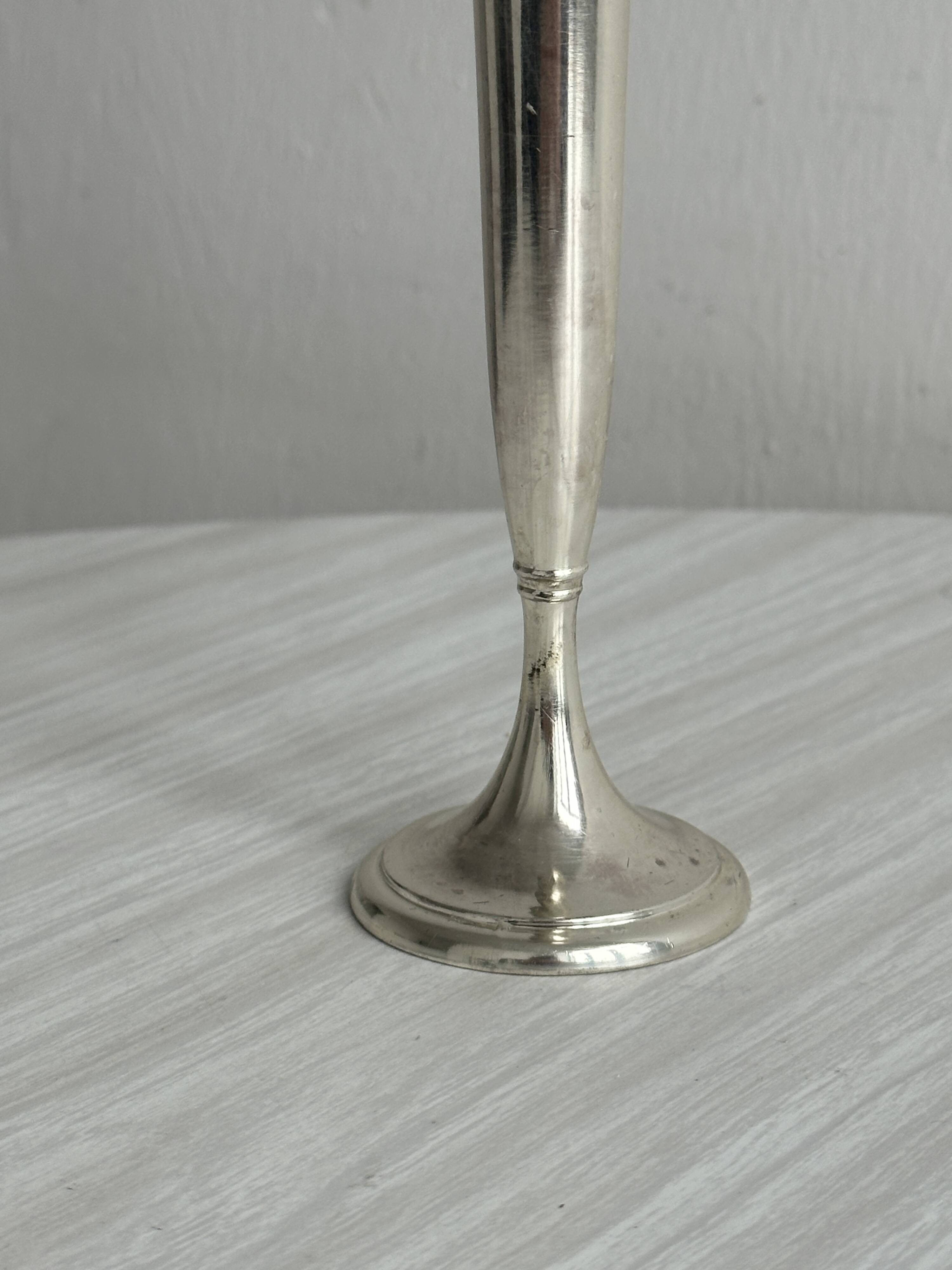 Small shiny metal bud vase