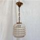 Suspension vintage composée d’un globe en verre dimension : hauteur -38cm- diamètre -12,5cm-
