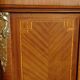 Three-door wardrobe with marquetry and bronze.