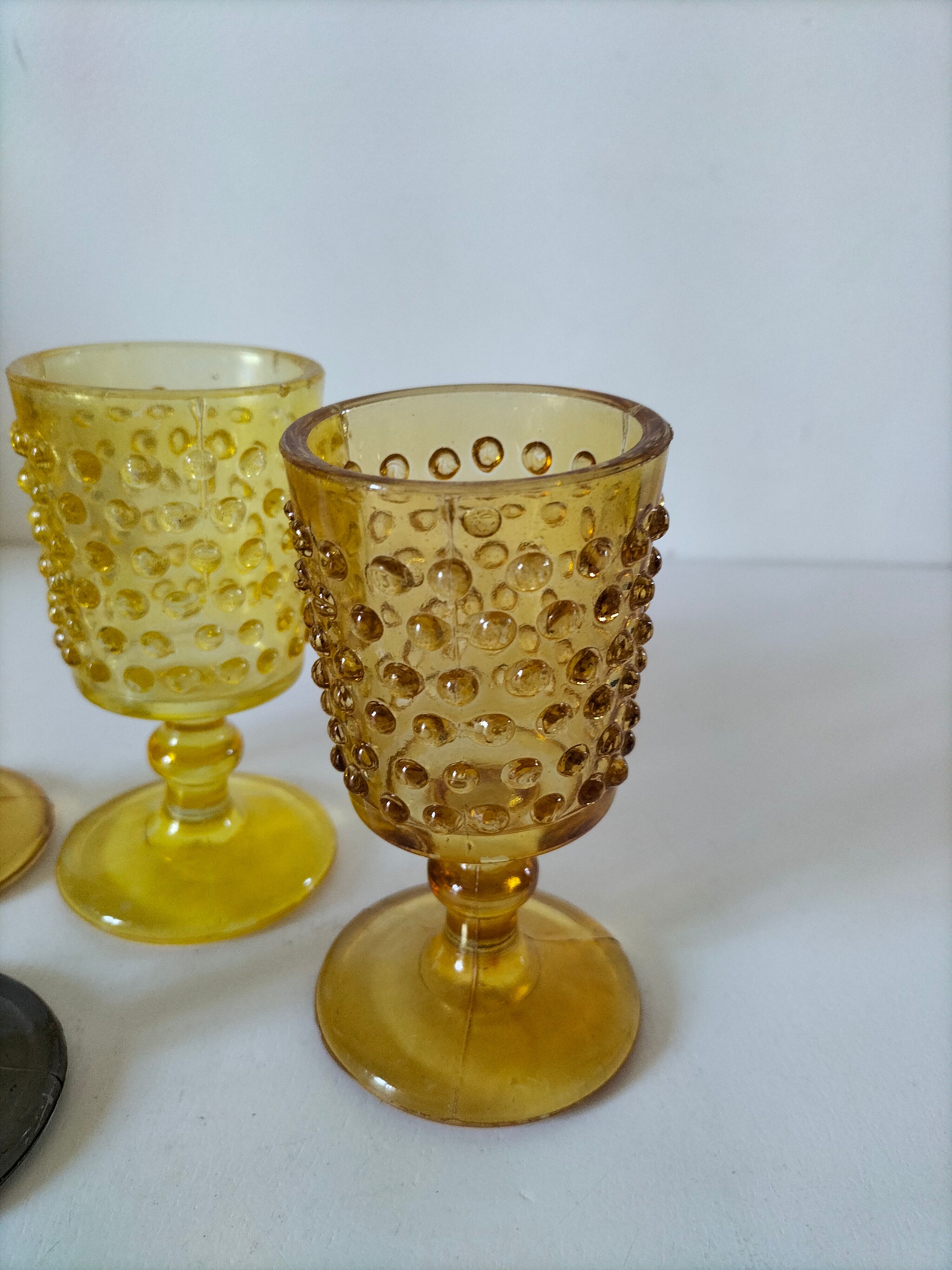 4 vintage stemmed glasses in hobnail glass and smoke colour.