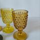 4 vintage stemmed glasses in hobnail glass and smoke colour.