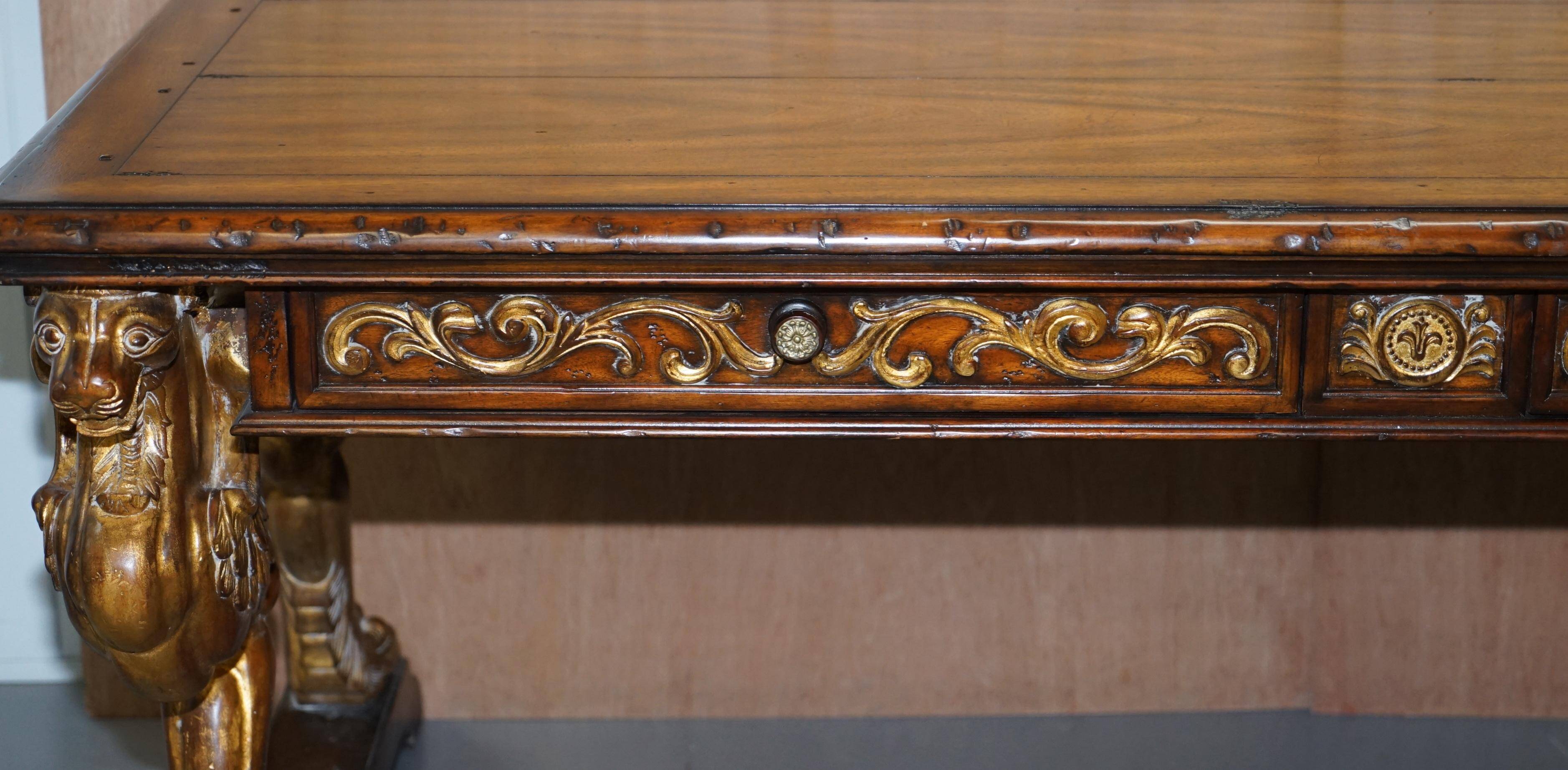 Double-sided writing desk in hardwood with gilt griffins, RJ Horner style.