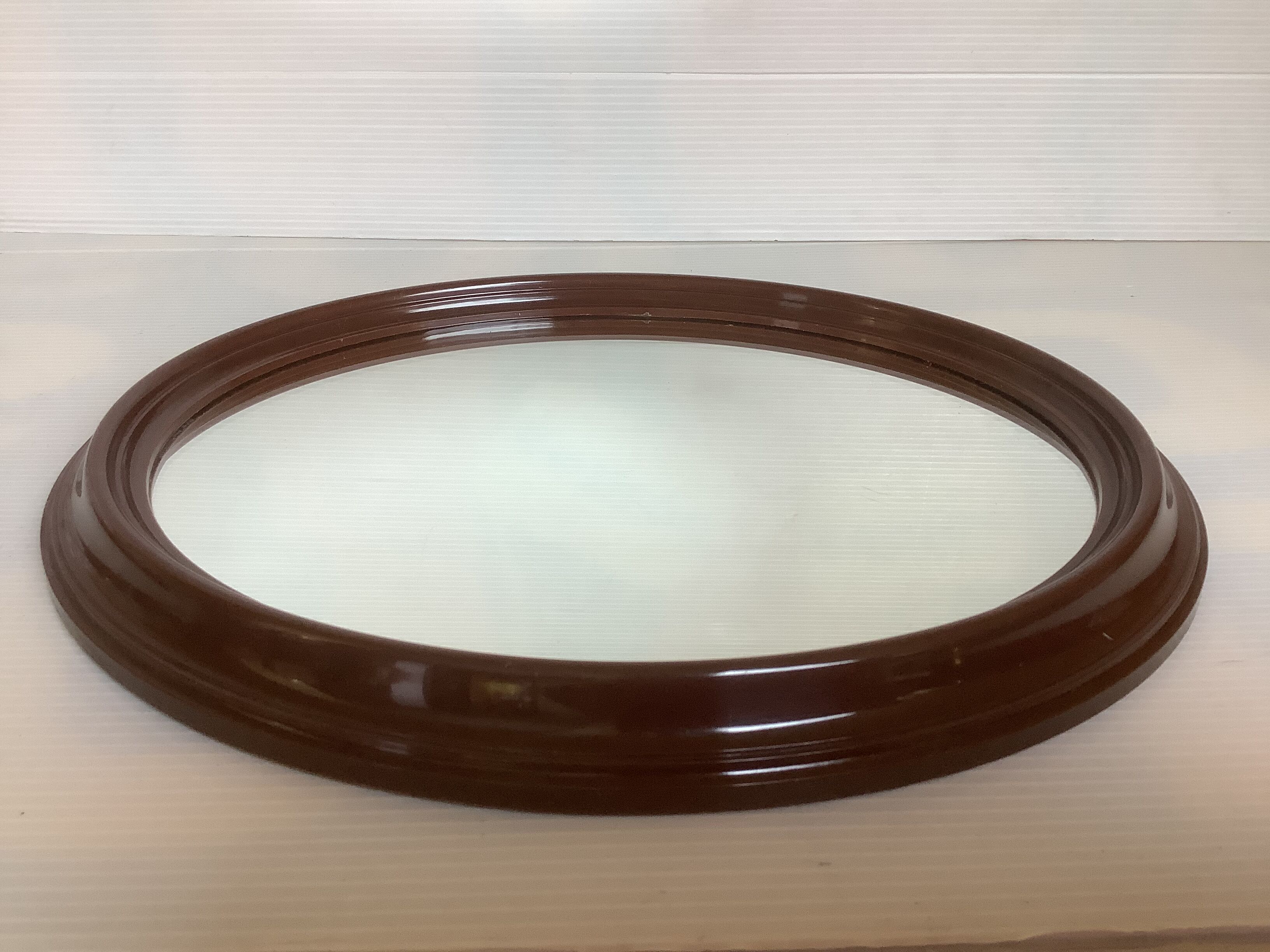 Brown plastic oval mirror made in belgium