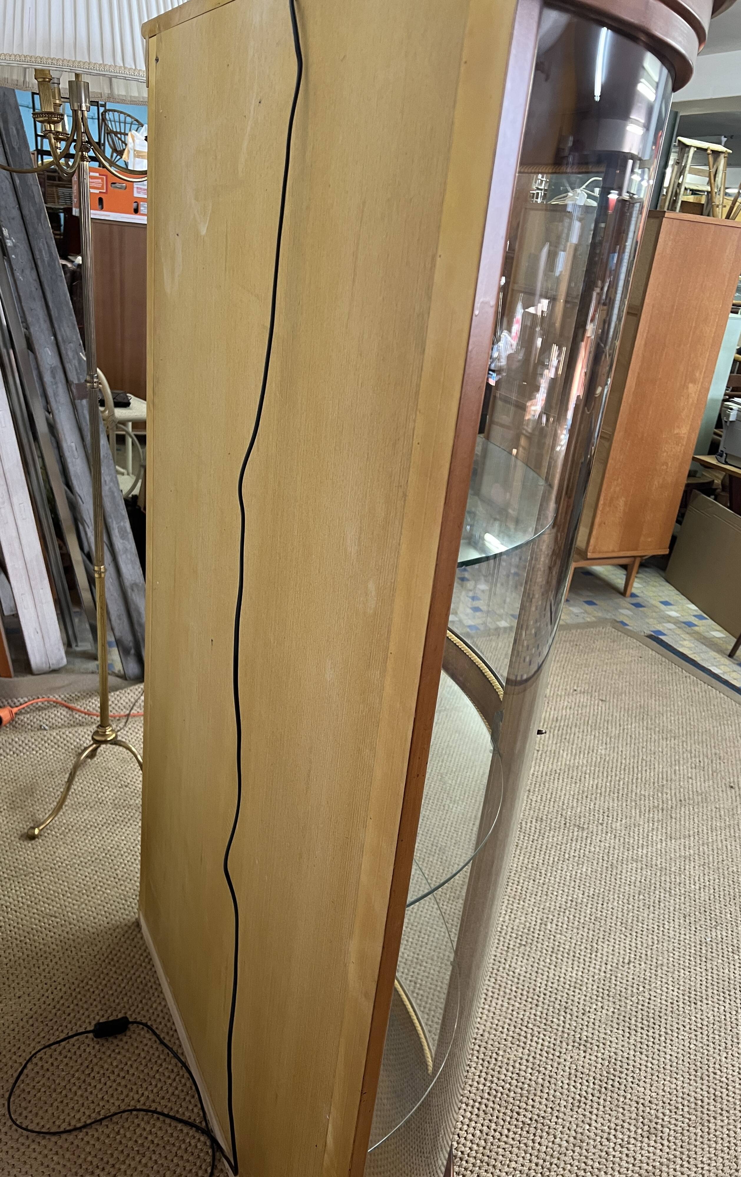 Wooden display case and half-moon mirror