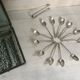 12 teaspoons silver metal