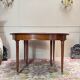 Dining table with a mahogany band in louis xvi style