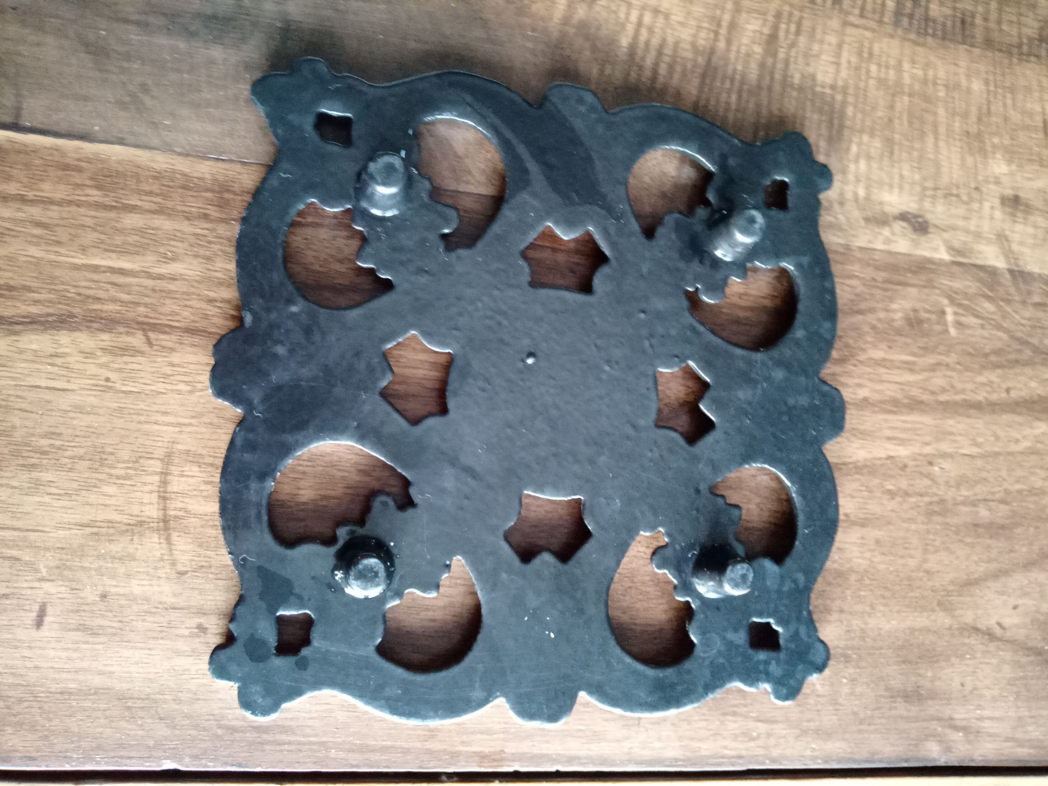 Old dish bottoms in black cast iron