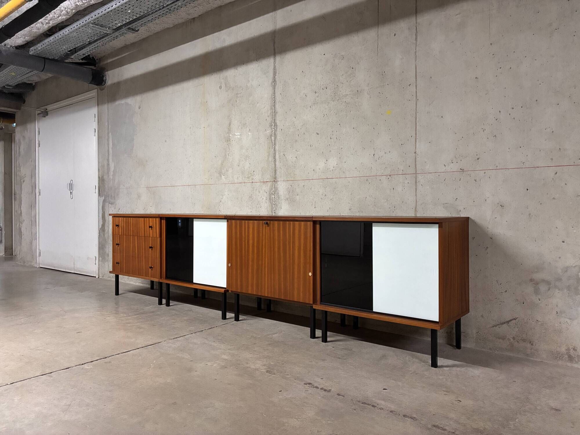 Enfilade buffet display cabinet in vintage 1950s style.