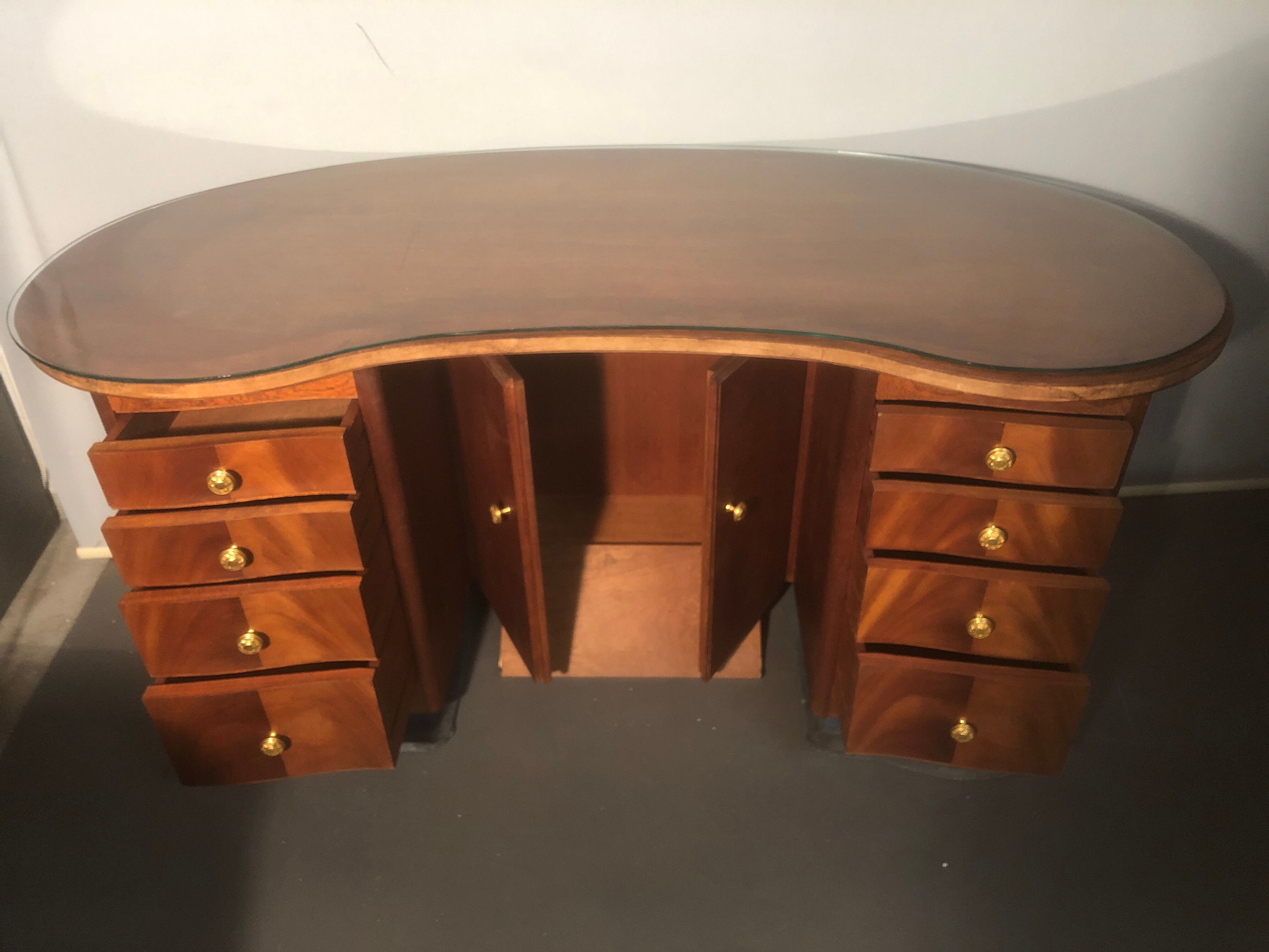 1940 desk in kidney shape with 8 drawers, 2 doors and footrest royere style