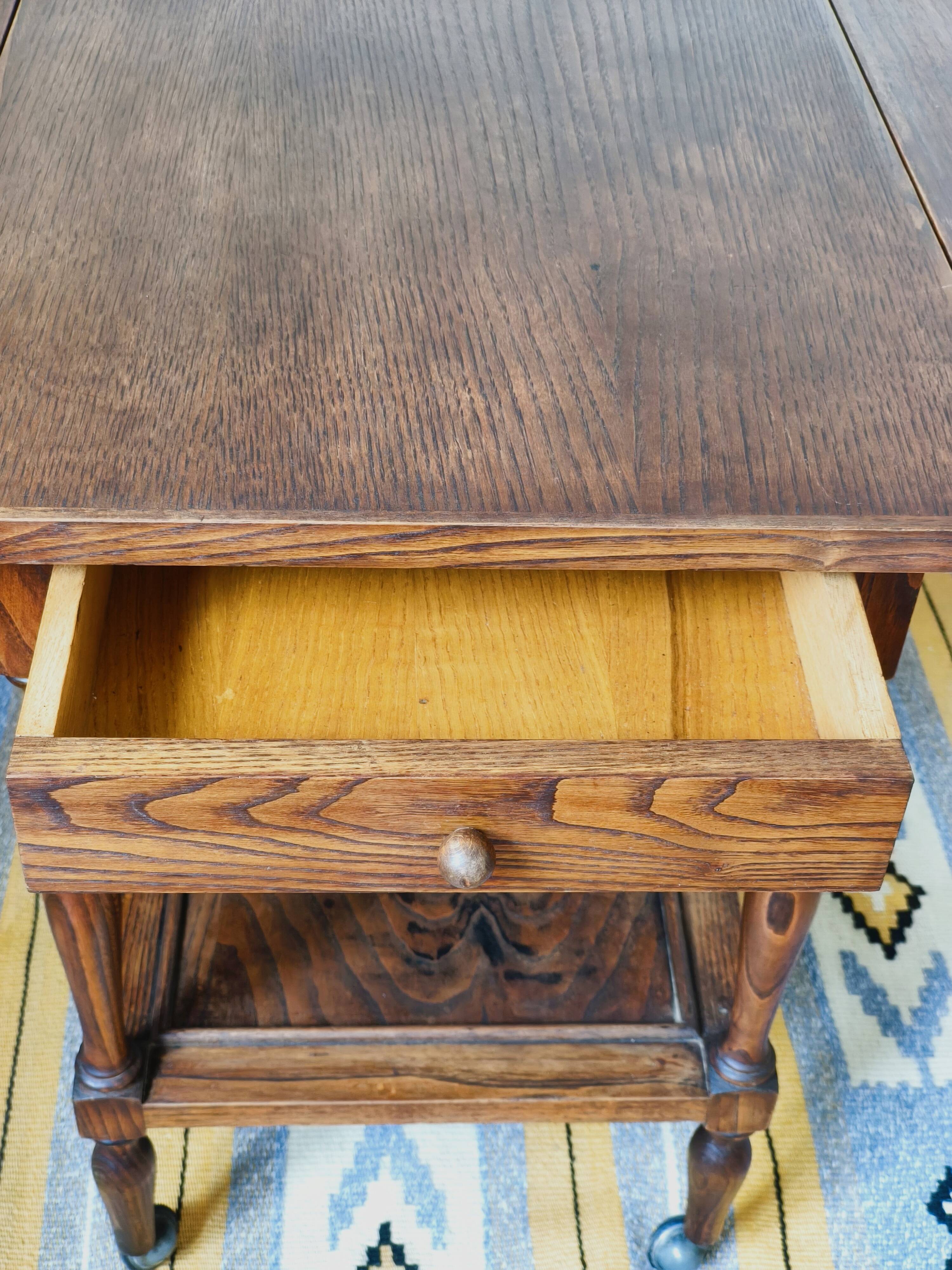 Folding dessert table in solid chestnut, 2 drawers, wheels, 20th century.