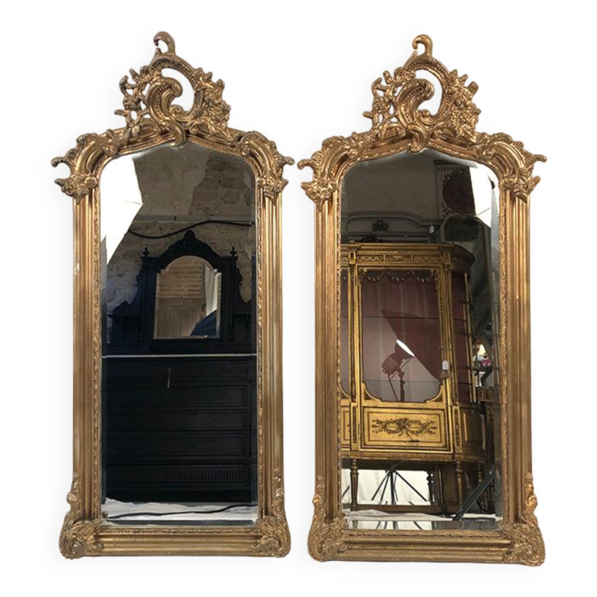 Pair of Louis XV style mirrors, stuccoed and gilded wood, beveled mirrors