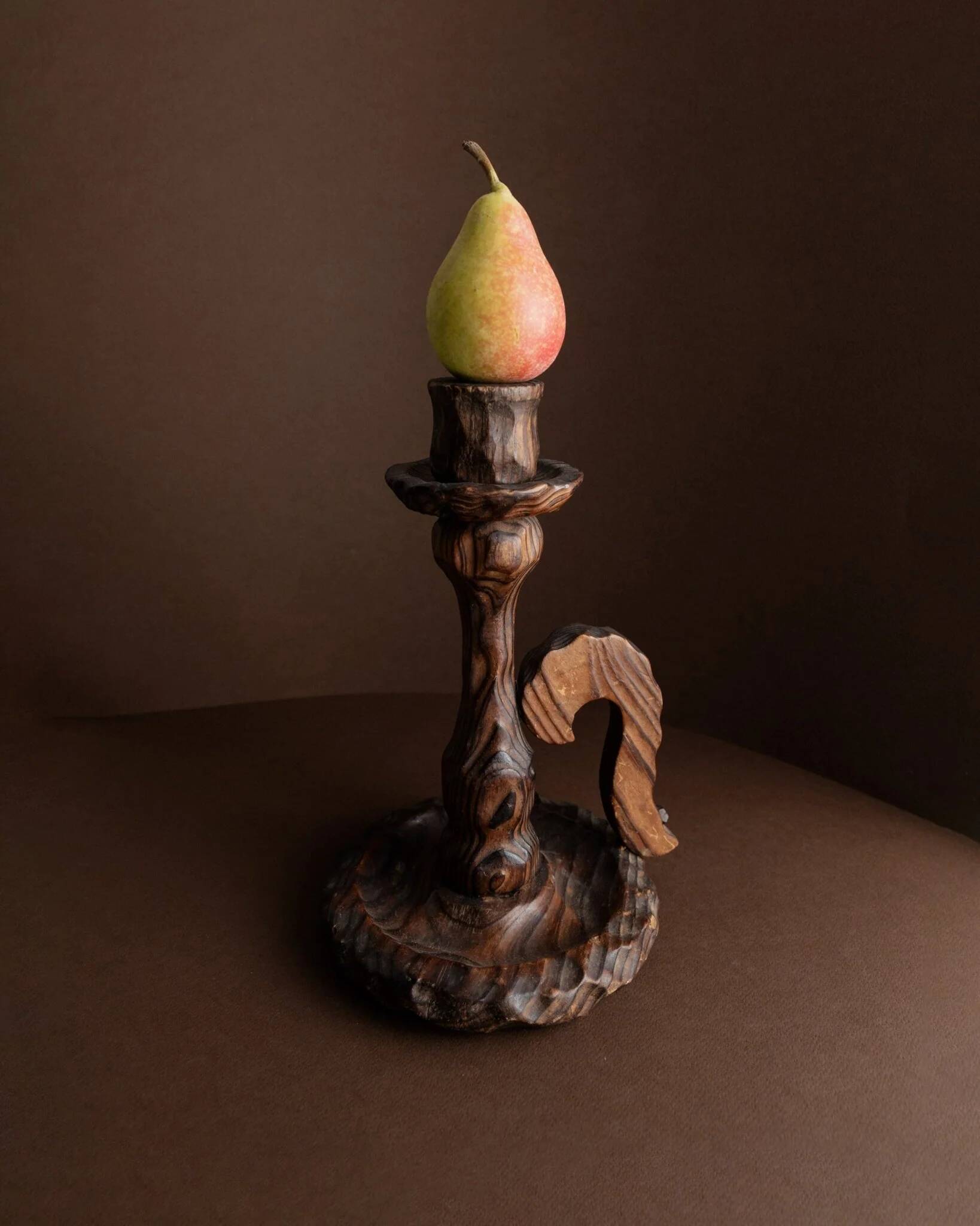 Brutalist carved wood candle holder, dark brown with lighter highlights, made in Italy, 1940s