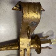 Spanish brutalist wall light in gilded wrought iron.