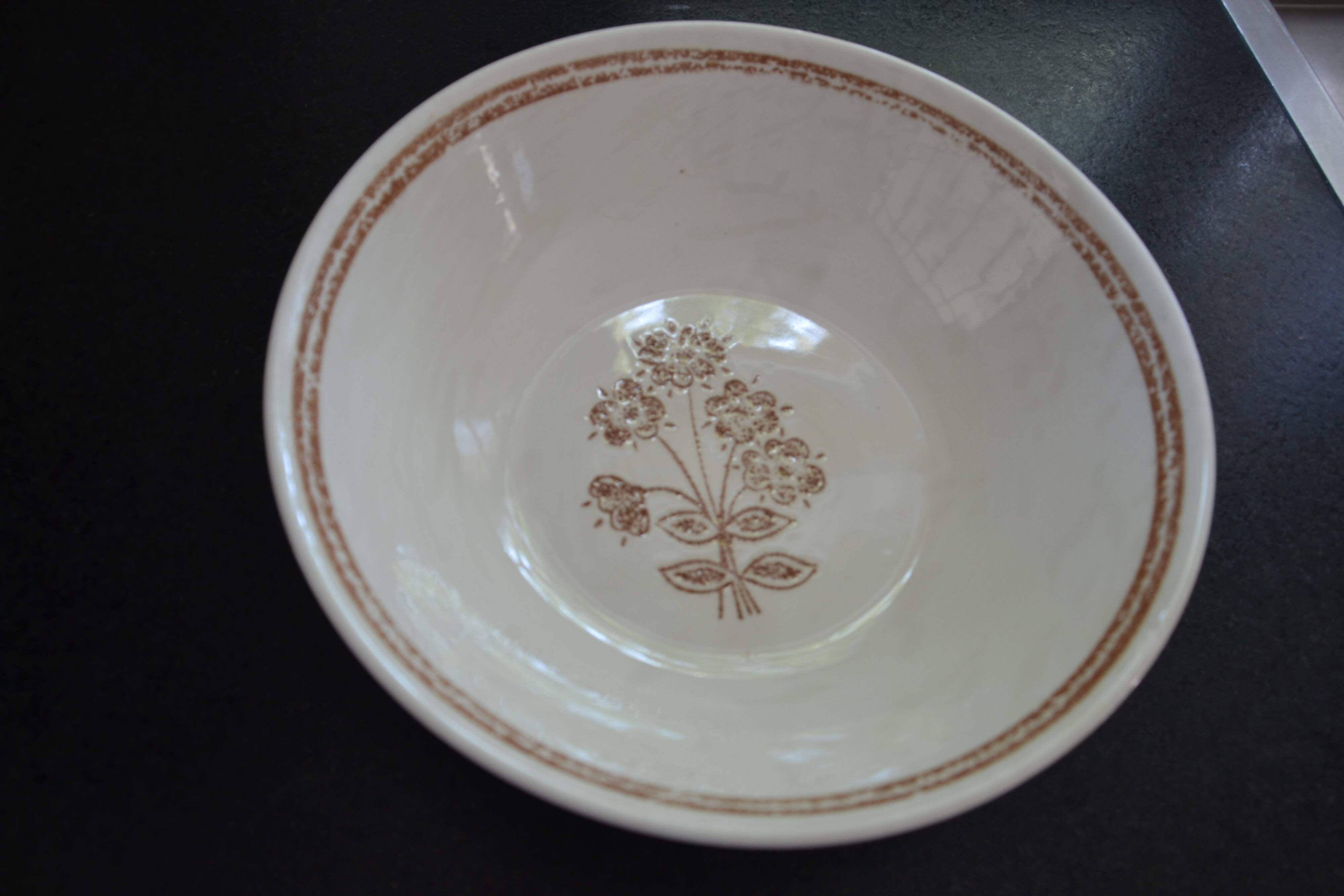Set of 7 soup plates, dishes and a tureen with flower decoration