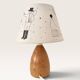 Wood-turned lamp with a hand-drawn lampshade, circus patterns.