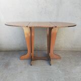 Oval table with formica flap