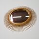 Golden metal sun mirror of the 1950s