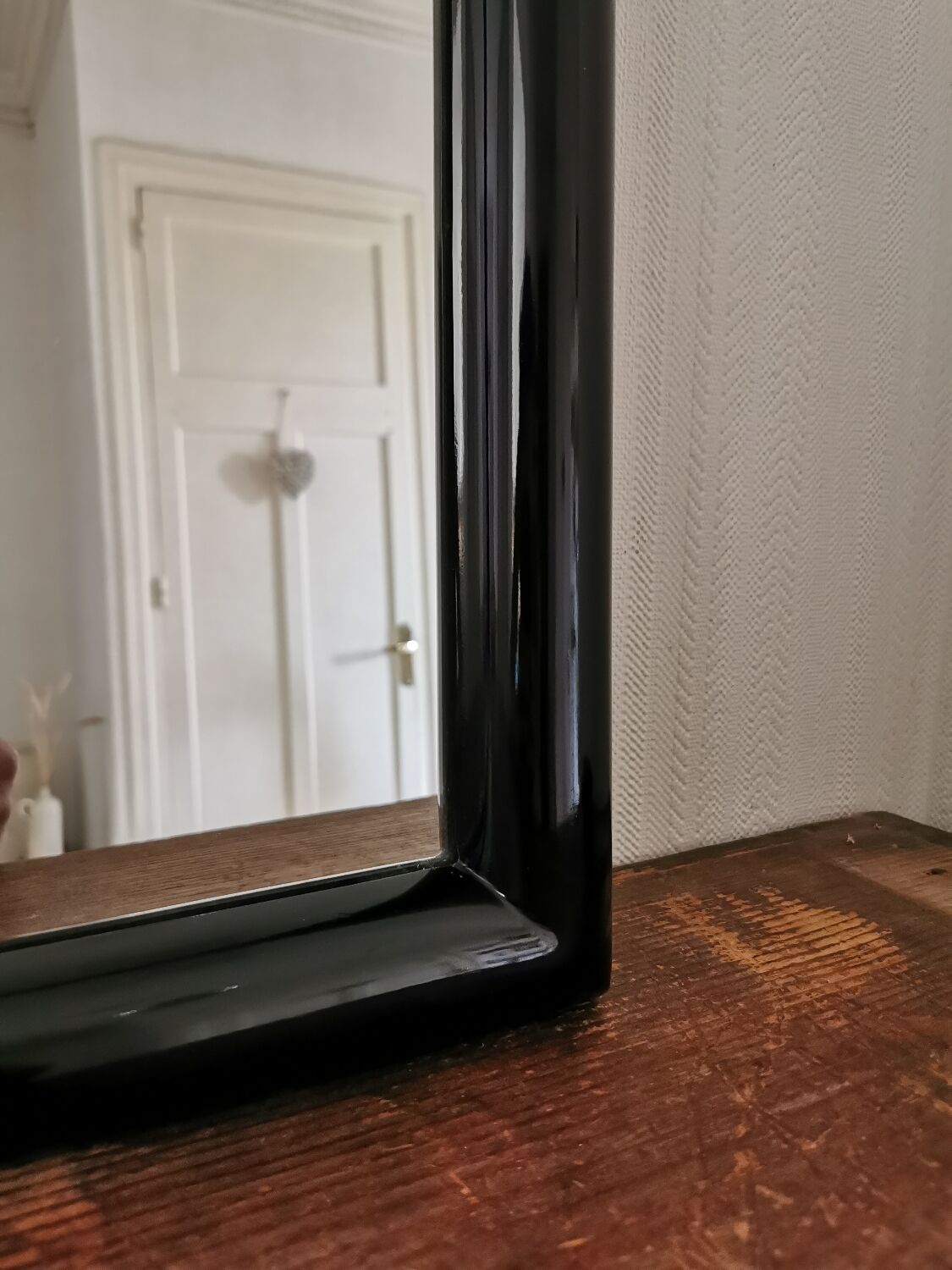 Large black lacquered mirror 1970