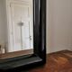 Large black lacquered mirror 1970