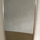 Vintage 1960s mirror in a freeform shape with a gold and red trim.
