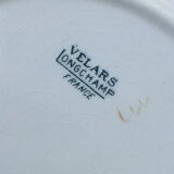 Round flat and hollow Longchamp Velars in Iron Earth