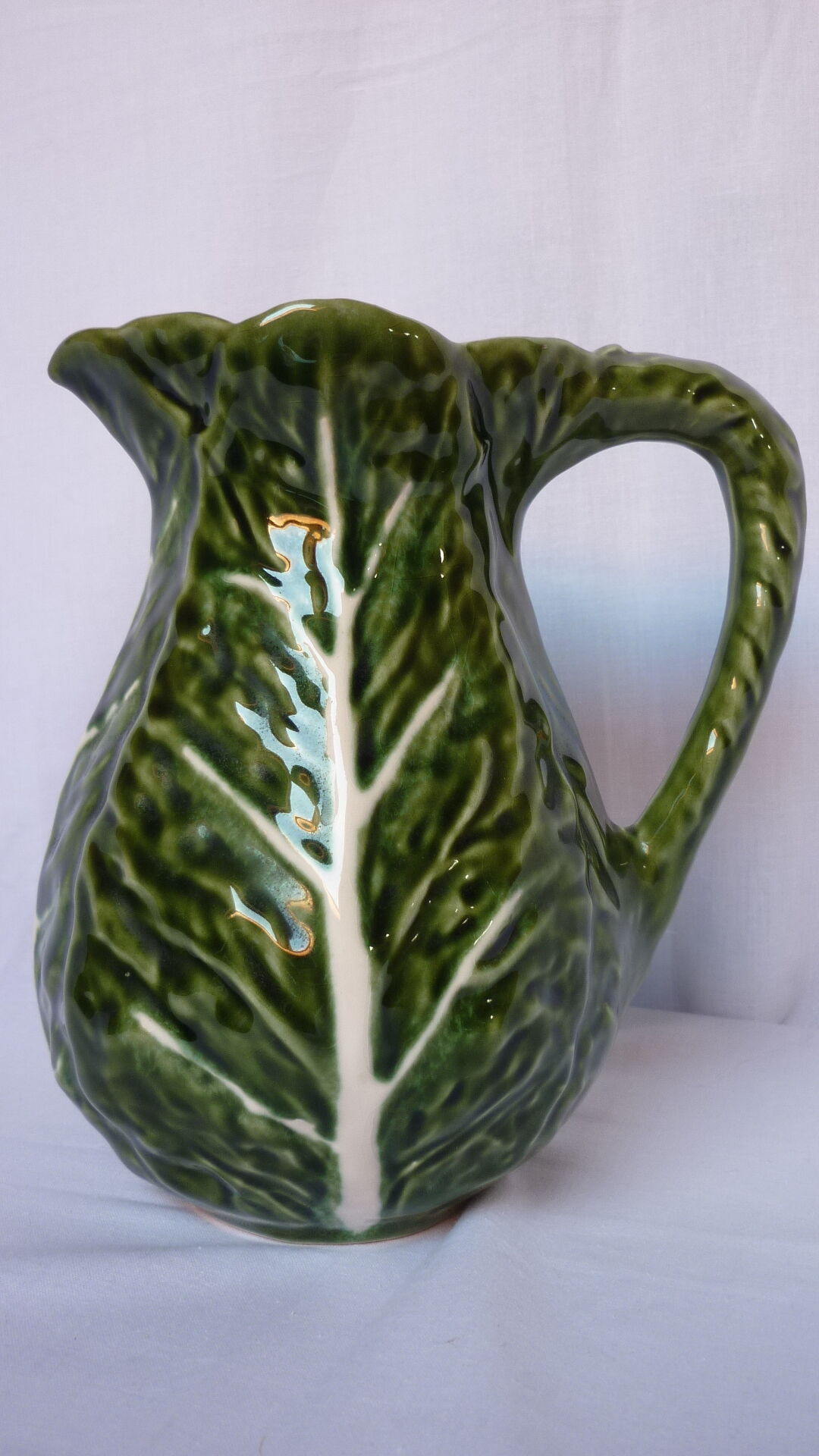 Pitcher dabbling cabbage leaf