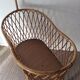 Vintage rattan cradle with its spire