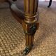 Important central pedestal table in mahogany, brass and bronze that can form a large dining table.