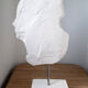 Young woman's head in plaster