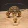 Italian lacquered and gilded round coffee table with glass top