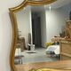Large vintage mirror with an animated shape and Louis XV baroque style shell