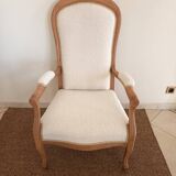 Renovated Voltaire armchair with boucle fabric.