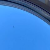 Vintage round smoked plastic mirror, circa 1970s.