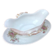 Sauce boat on dormant white porcelain, floral decoration