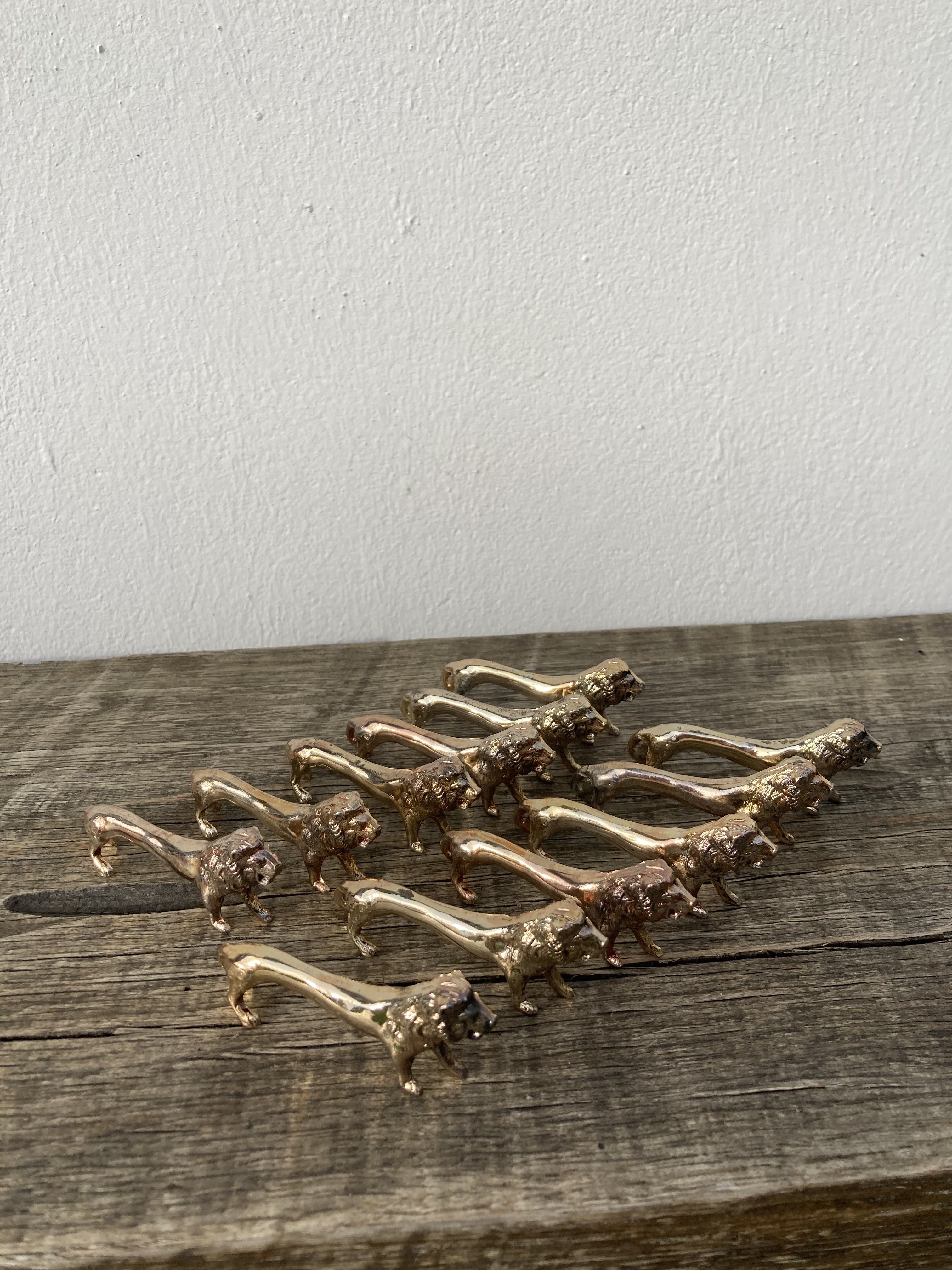 12 vintage gilded gold metal lion animal knife holders