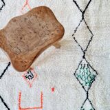 White wool Berber rug with fluorescent orange green patterns