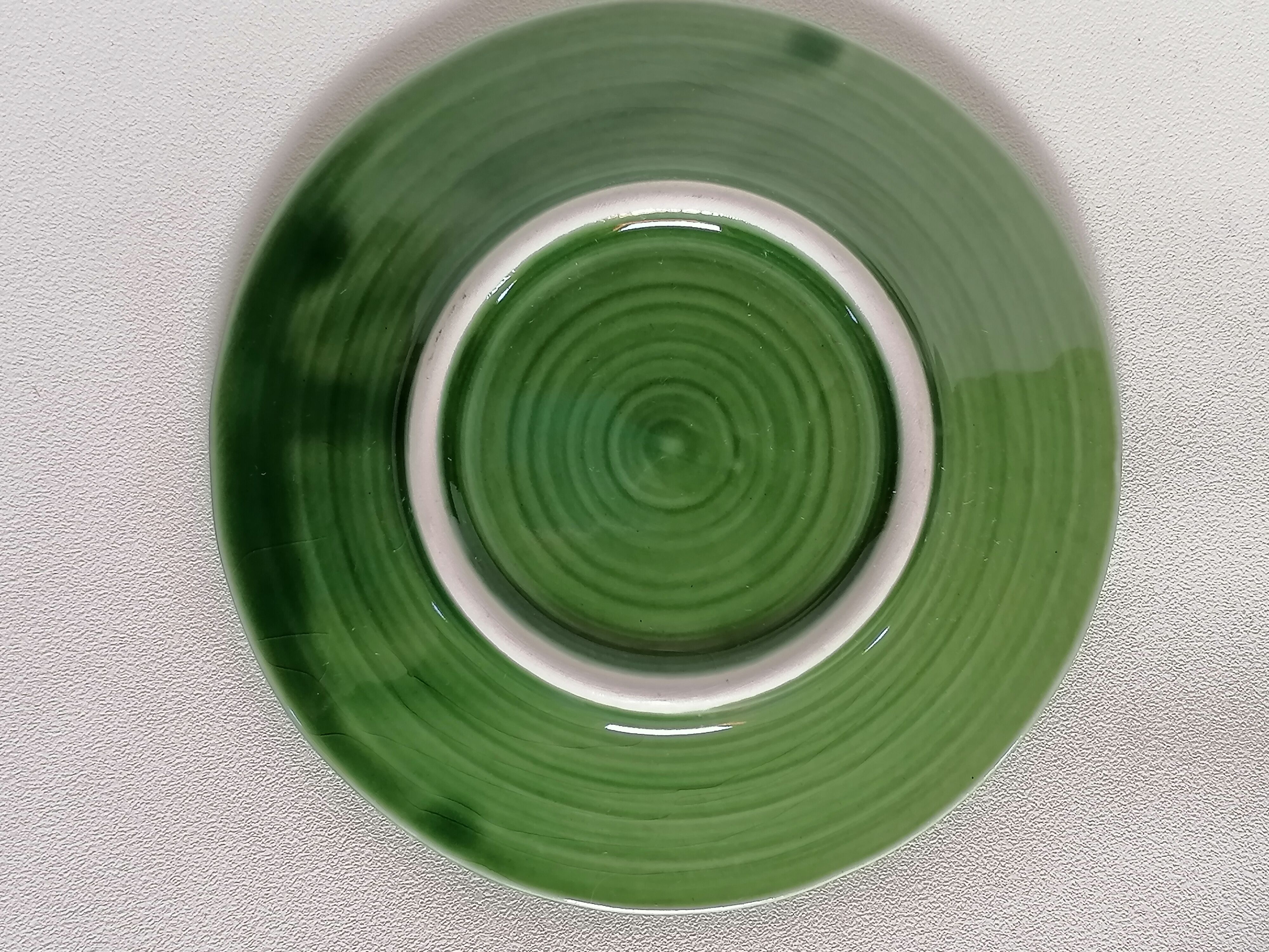 Two bowls in dabbling and their plates leaves cabbage