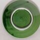 Two bowls in dabbling and their plates leaves cabbage