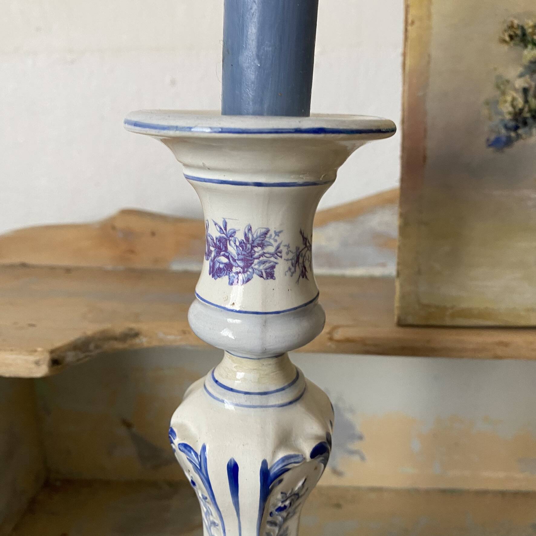 Antique Gien candlestick with ribbon and garland decoration.