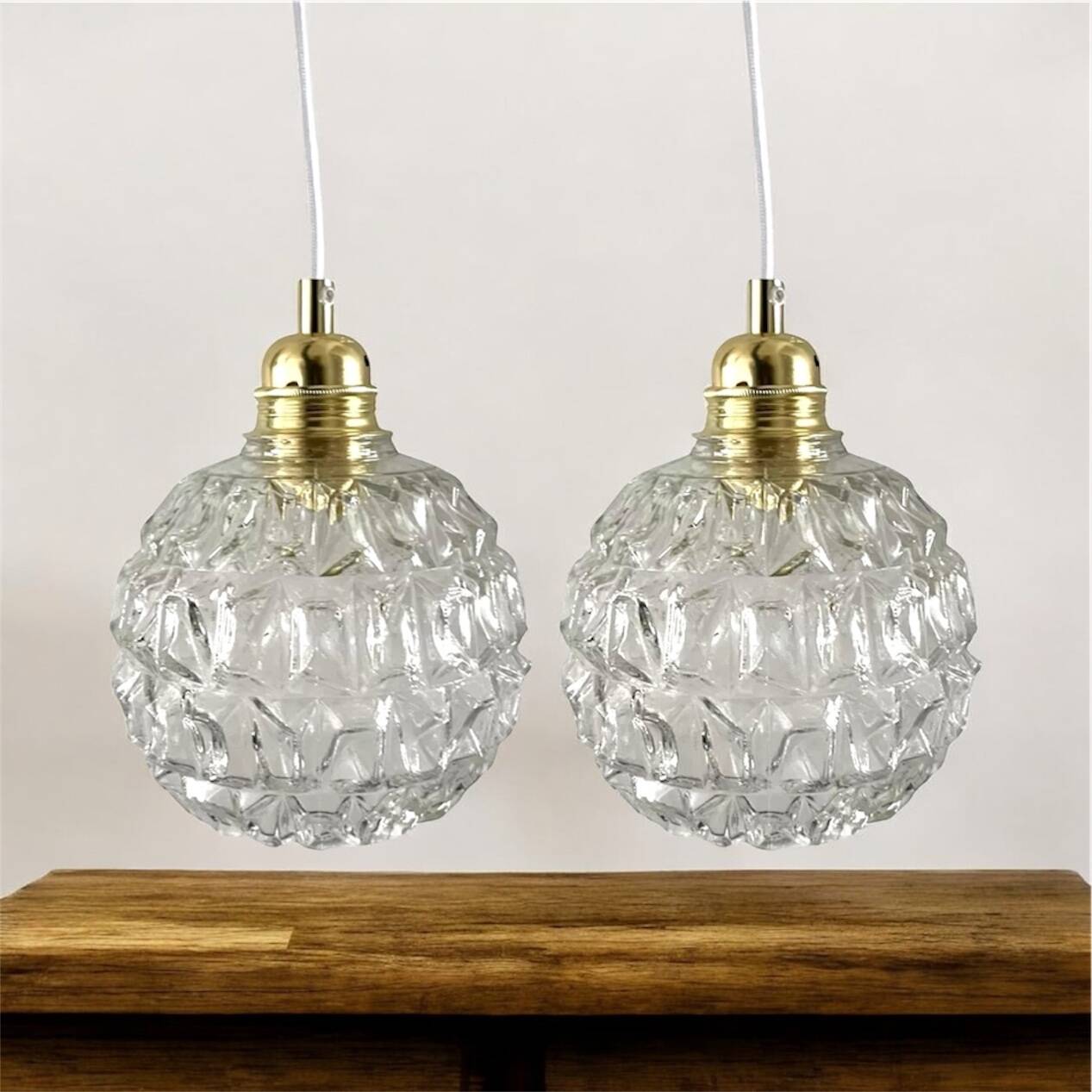 Set of two chiseled glass pendant lights